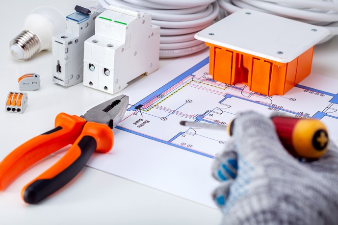 electrician-working-with-electrical-scheme